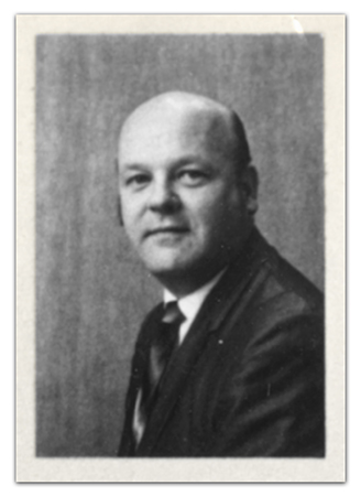 Black and white, head and shoulders portrait of Principal William Campbell taken during the 1970 to 1971 school year.